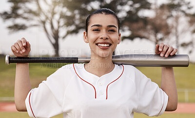 Buy stock photo Shot of an attractive young woman standing alone outside and posing with a baseball bat