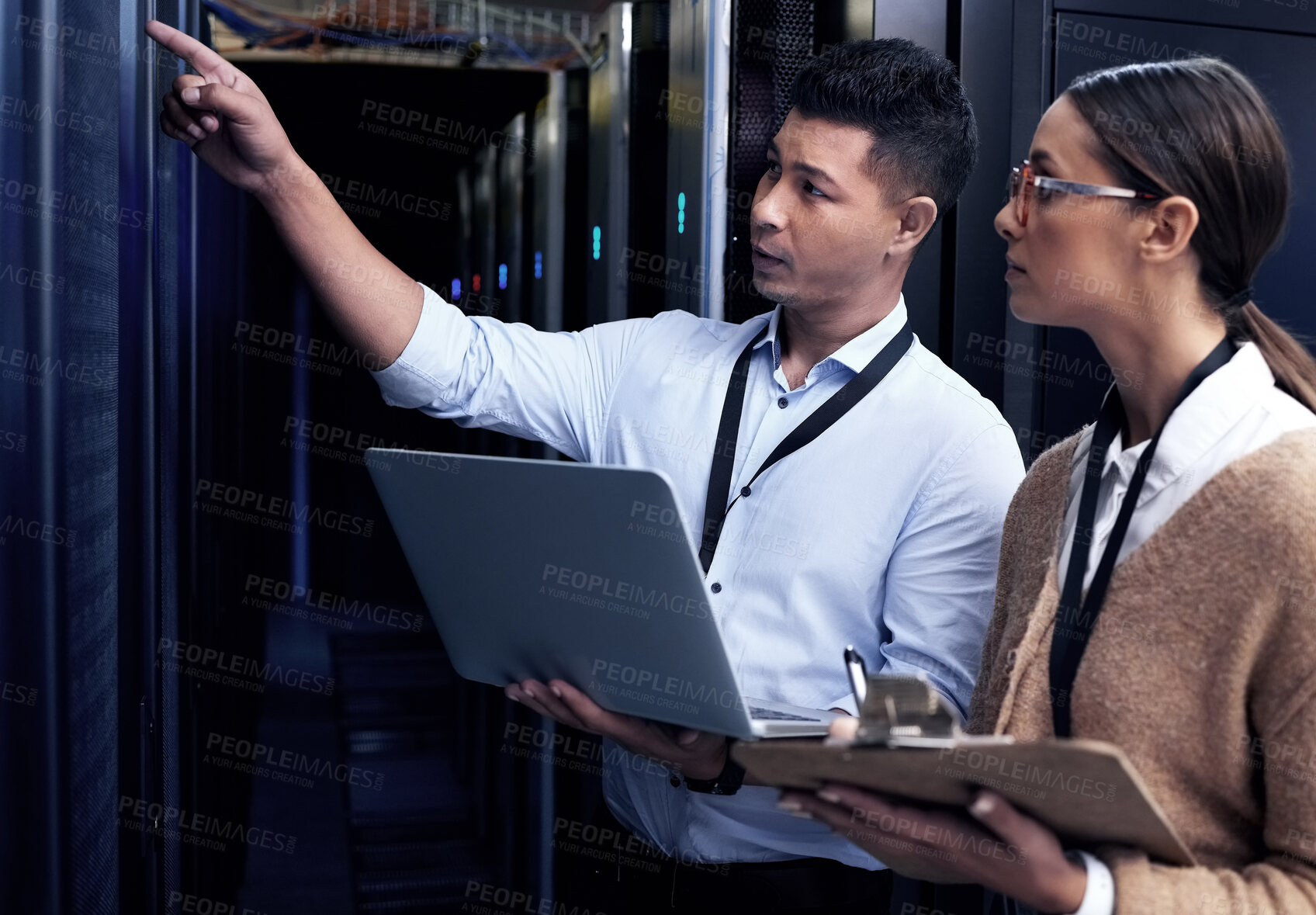 Buy stock photo Data center, people and laptop with checklist, collaboration and safety as computer engineer. Team, technician and technology for hardware, security and server room for system update or maintenance