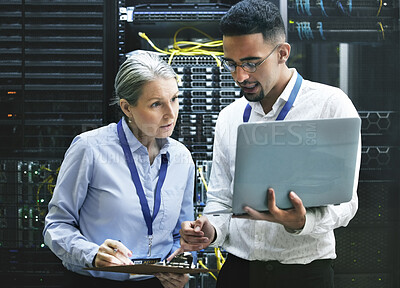 Buy stock photo Laptop, clipboard and technicians in a server room for technology installation or cyber security. Digital software, system update and senior manager working on coding database with a male programmer.