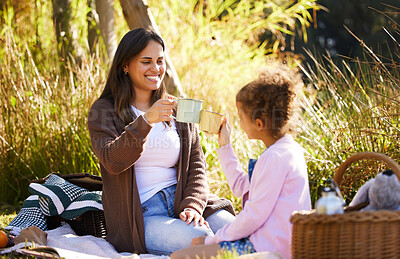 Buy stock photo Mom, child and toast together for outdoor picnic with coffee drink, summer and bonding in nature. Mama, young girl and cheers with espresso cup, love relationship and happy family on grassy field