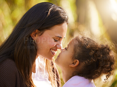 Buy stock photo Cropped shot of an attractive young woman and her daughter sharing an intimate moment during their picnic in the park
