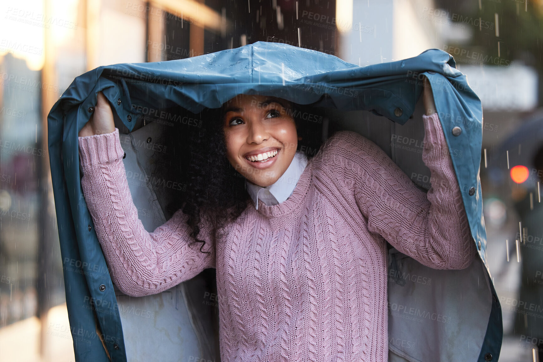 Buy stock photo Business woman, coat and rain in city for morning travel, security and outdoor walking with smile. Female employee, happy and jacket for winter storm with urban commute, insurance and protection