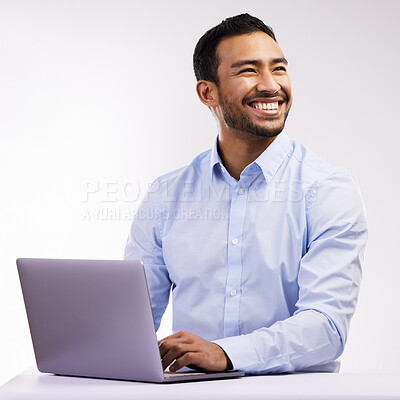 Buy stock photo Studio shot of a young businessman using a laptop against a white background