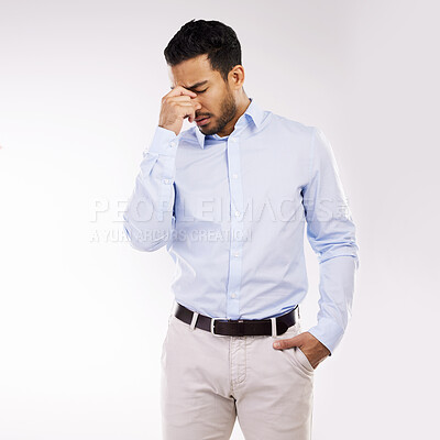 Buy stock photo Studio shot of a young businessman looking stressed out against a white background