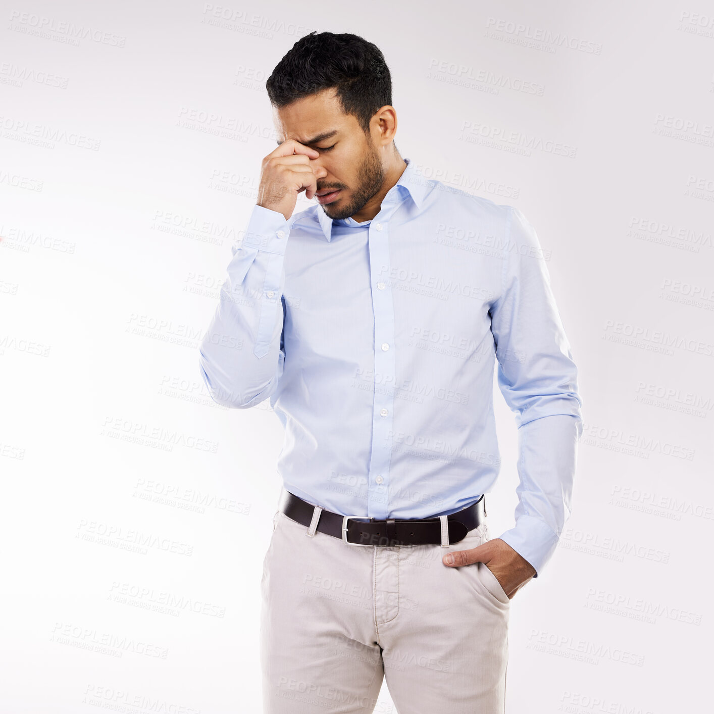 Buy stock photo Studio shot of a young businessman looking stressed out against a white background