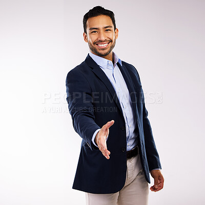 Buy stock photo Studio shot of a handsome young man  extending his arm for a handshake against a grey background