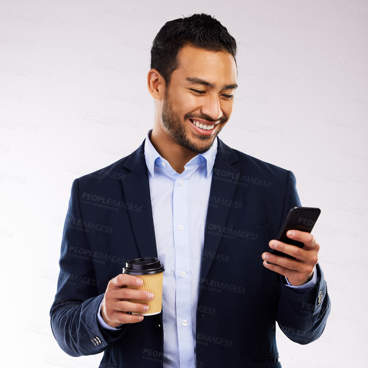 Buy stock photo Coffee, smile and businessman with phone in studio for communication, network and morning update. Happy, Indonesian paralegal and tech with drink for client, feedback and law news on white background