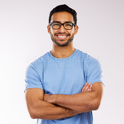 Buy stock photo Crossed arms, glasses and man with smile in studio for pride with website development career. Happy, IT and portrait of male programmer from Indonesia with confidence with vision by gray background.