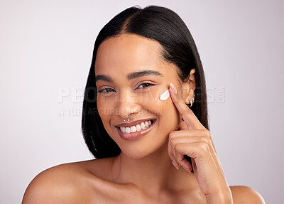 Buy stock photo Happy woman, portrait and face cream for skincare, beauty or cosmetics against a grey studio background. Female person or model smiling for lotion, creme or cosmetic moisturizer or facial treatment