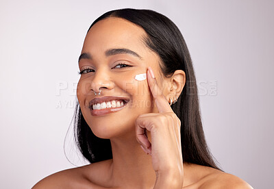 Buy stock photo Happy woman, portrait and skincare cream on face for beauty or cosmetics against a grey studio background. Female person or model smiling for lotion, creme or cosmetic moisturizer or facial treatment