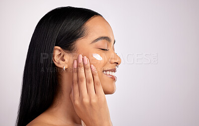 Buy stock photo Happy woman, face cream and mockup for skincare cosmetics or beauty against a grey studio background. Female person smiling with lotion, creme or moisturizer for facial treatment on mock up space