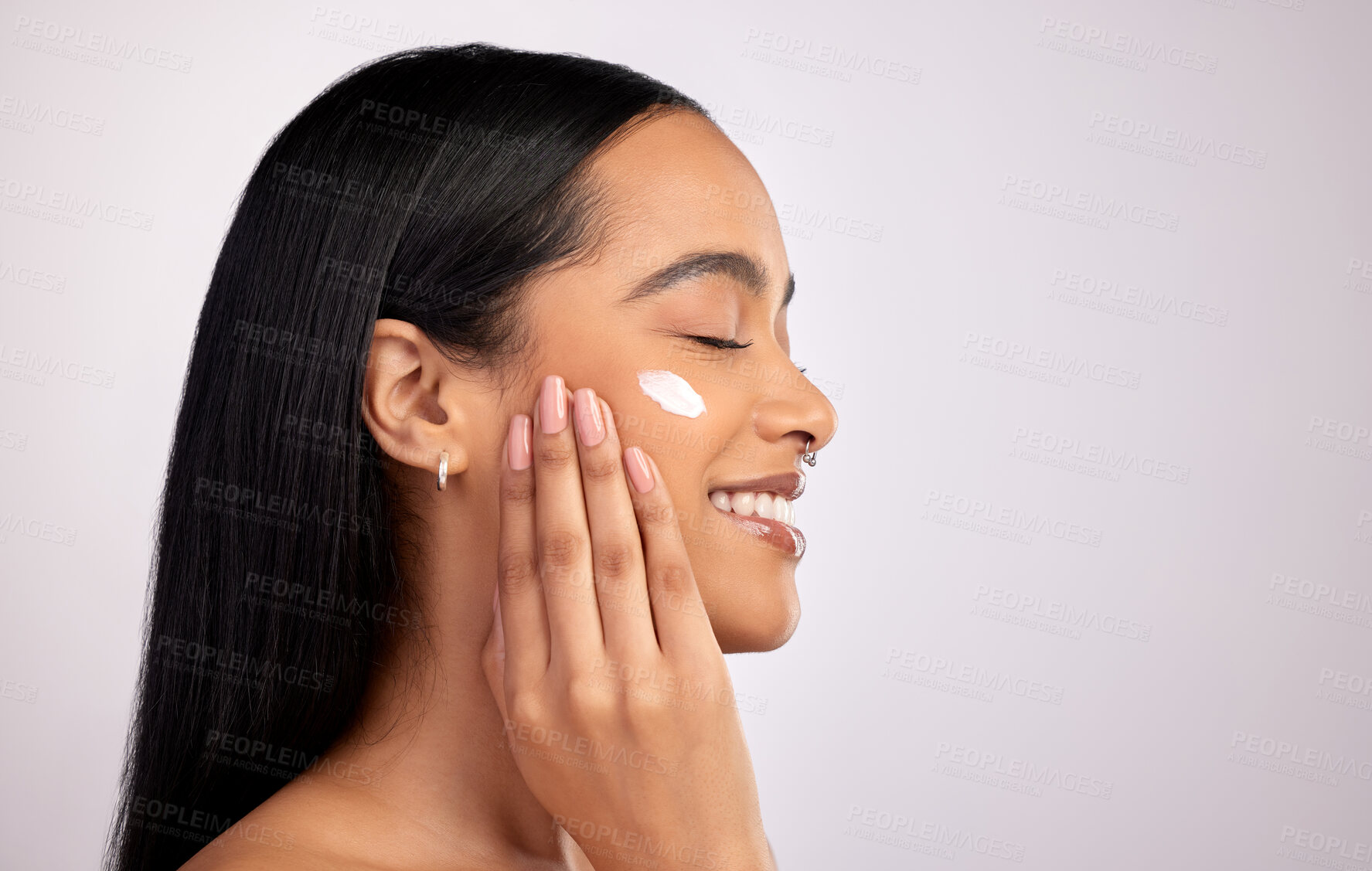 Buy stock photo Happy woman, face cream and mockup for skincare cosmetics or beauty against a grey studio background. Female person smiling with lotion, creme or moisturizer for facial treatment on mock up space