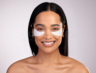 Buy stock photo Happy woman, portrait and eye patches for skincare, collagen or dermatology against a grey studio background. Face of female person or model smiling for beauty cosmetics, mask or facial treatment 