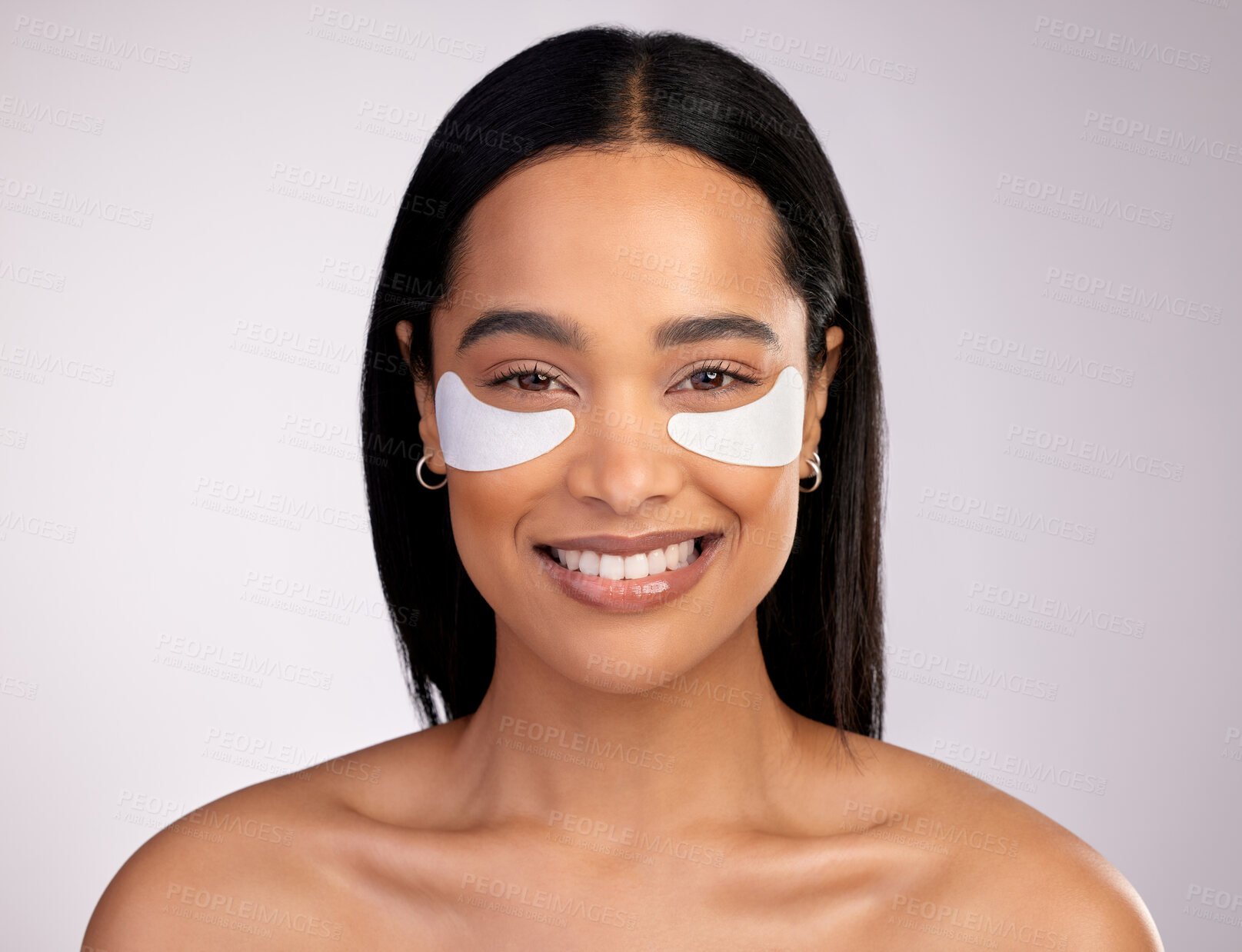 Buy stock photo Happy woman, portrait and eye patches for skincare, collagen or dermatology against a grey studio background. Face of female person or model smiling for beauty cosmetics, mask or facial treatment 