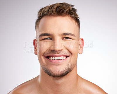 Buy stock photo Shot of a young man standing against a grey background