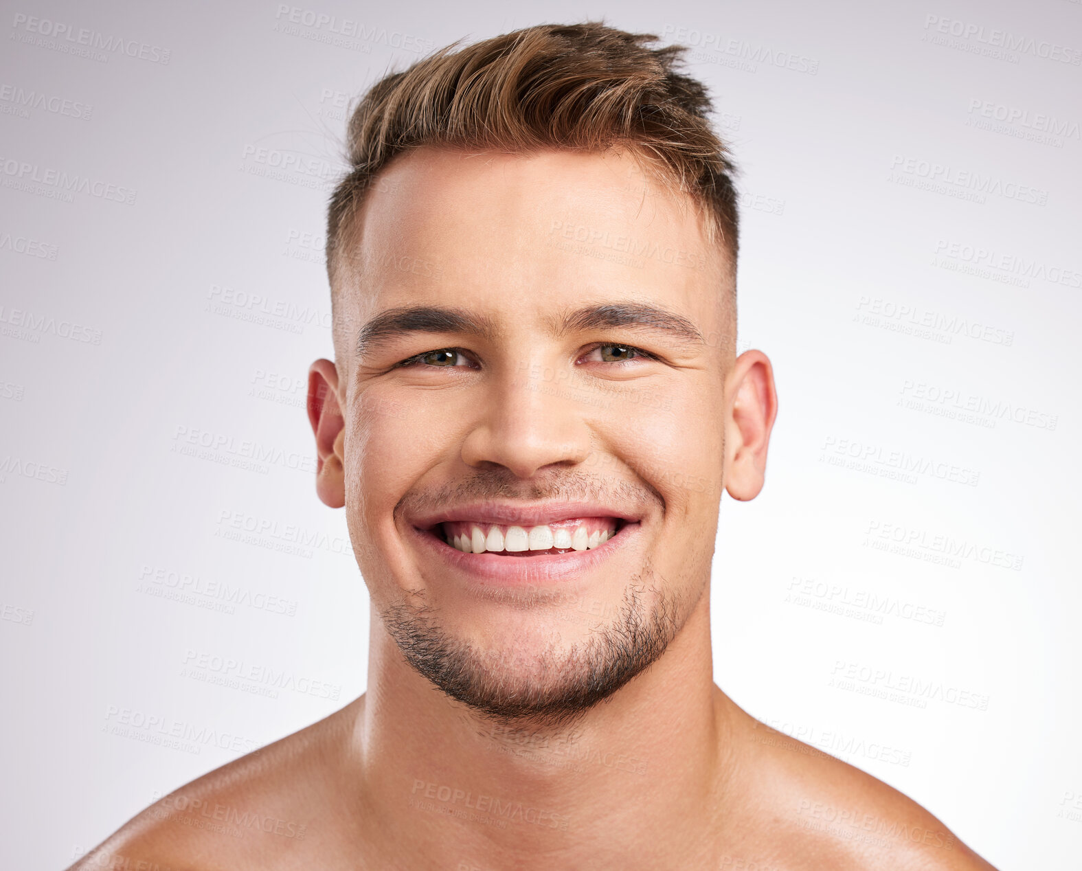 Buy stock photo Shot of a young man standing against a grey background