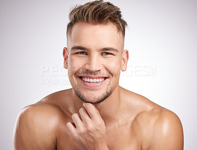 Buy stock photo Shot of a young man standing against a grey background