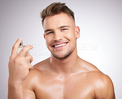 Buy stock photo Man, portrait and cologne in studio for health, cleaning and wellness or body care. Male person, skincare and hygiene in bathroom for cosmetics, perfume and antiperspirant by white background