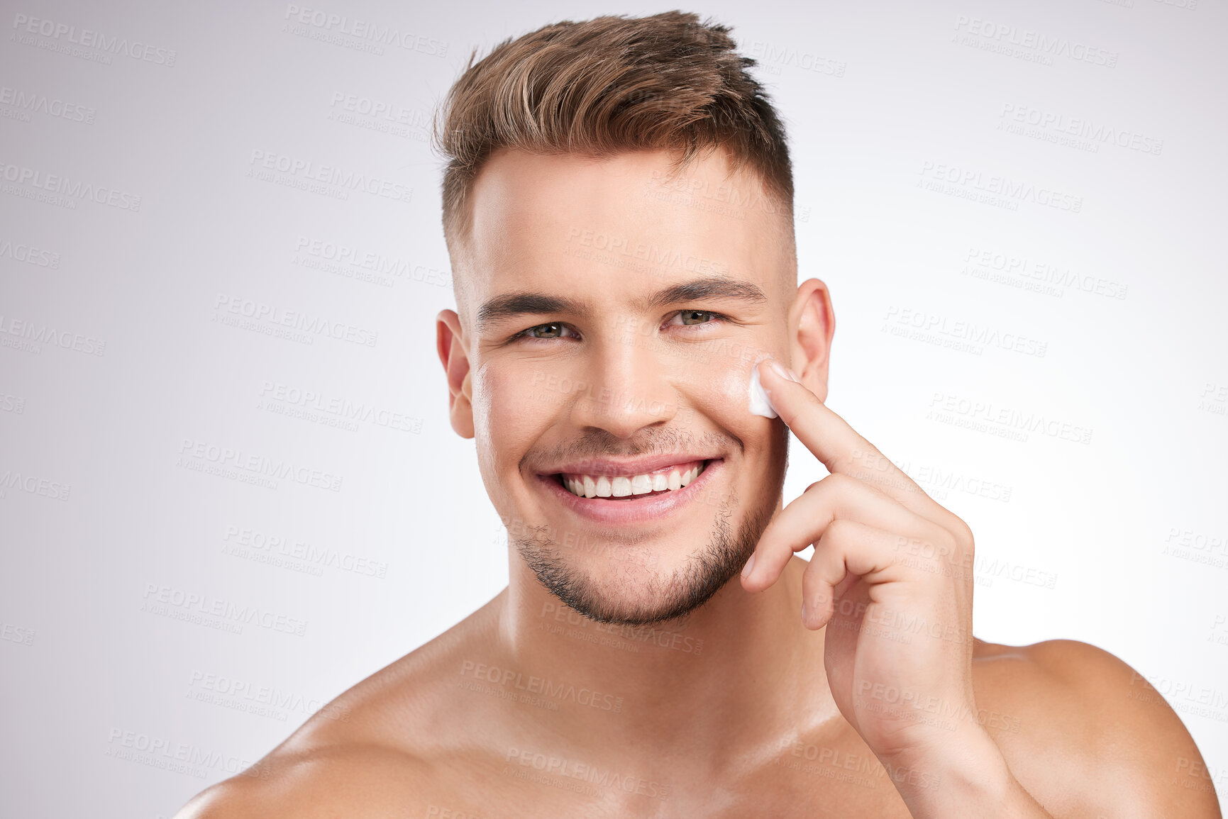 Buy stock photo Portrait smile, man and face cream for skincare with beauty, facial glow and skin health for natural shine in studio. Male person, dermatology and sunscreen with collagen benefits by white background