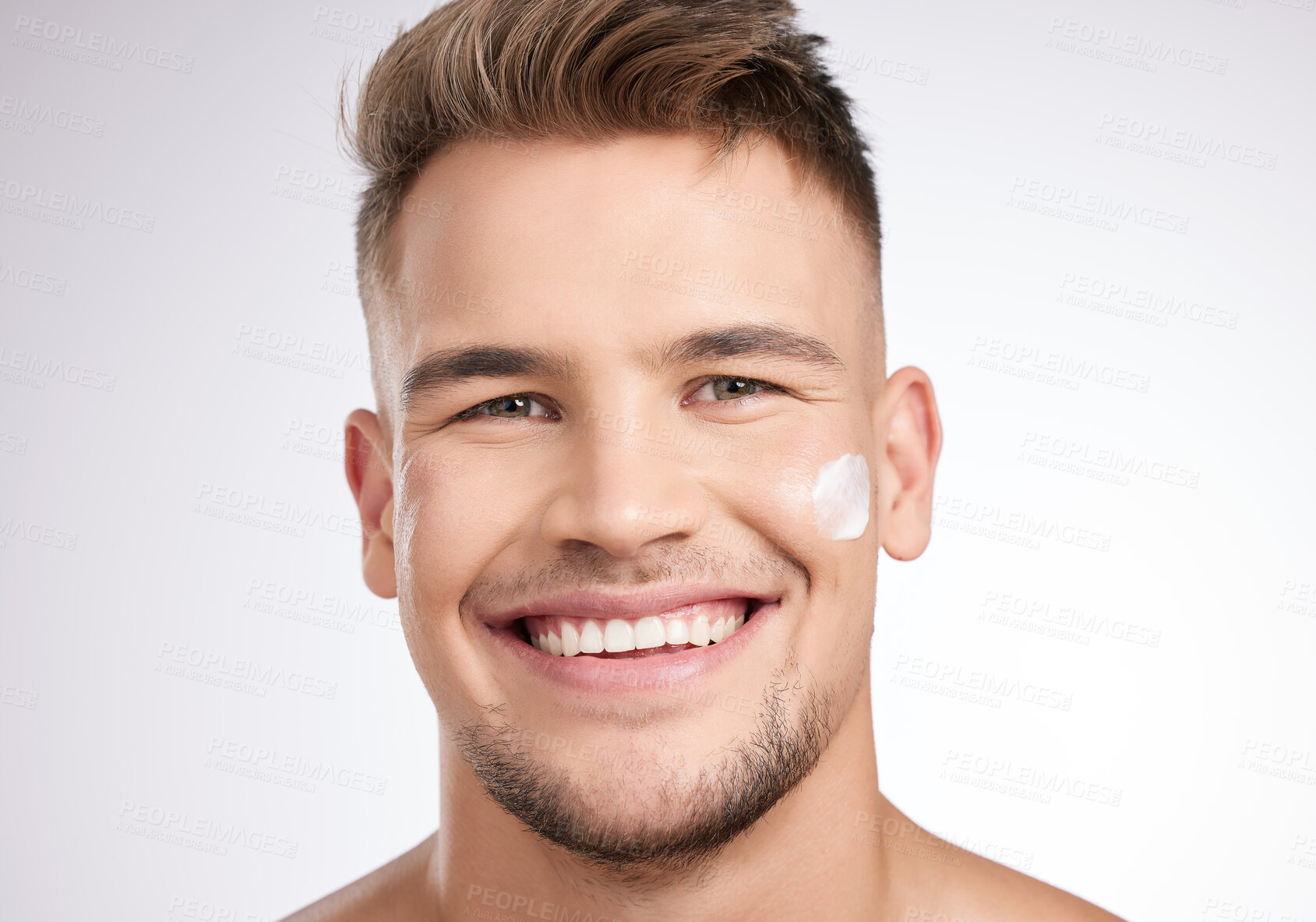 Buy stock photo Beauty, portrait and man in studio with cream for moisturizer, grooming or morning routine on white background. Skincare, wellness and model with confidence for lotion, treatment or satisfaction