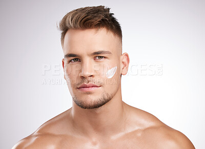 Buy stock photo Skincare, portrait and man in studio with cream for moisturizer, grooming or morning routine on white background. Body, wellness and model with confidence for lotion, cosmetics or satisfaction