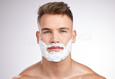 Buy stock photo Man, portrait and shaving foam on face in studio, grooming and facial care for beard hair removal with product. Serious, skincare and dermatology or cosmetology, cleaning hygiene and white background