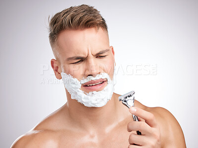 Buy stock photo Man, thinking and shaving cream with razor in studio, face tool and grooming or facial care for beard hair removal or product. Foam, skincare and dermatology or confused, hygiene and white background