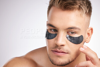 Buy stock photo Eye mask, man and idea for dermatology for hygiene, wellness and health or skincare. Male person, thinking and cosmetics with luxury for hydration, glow and shine or detox by white background 