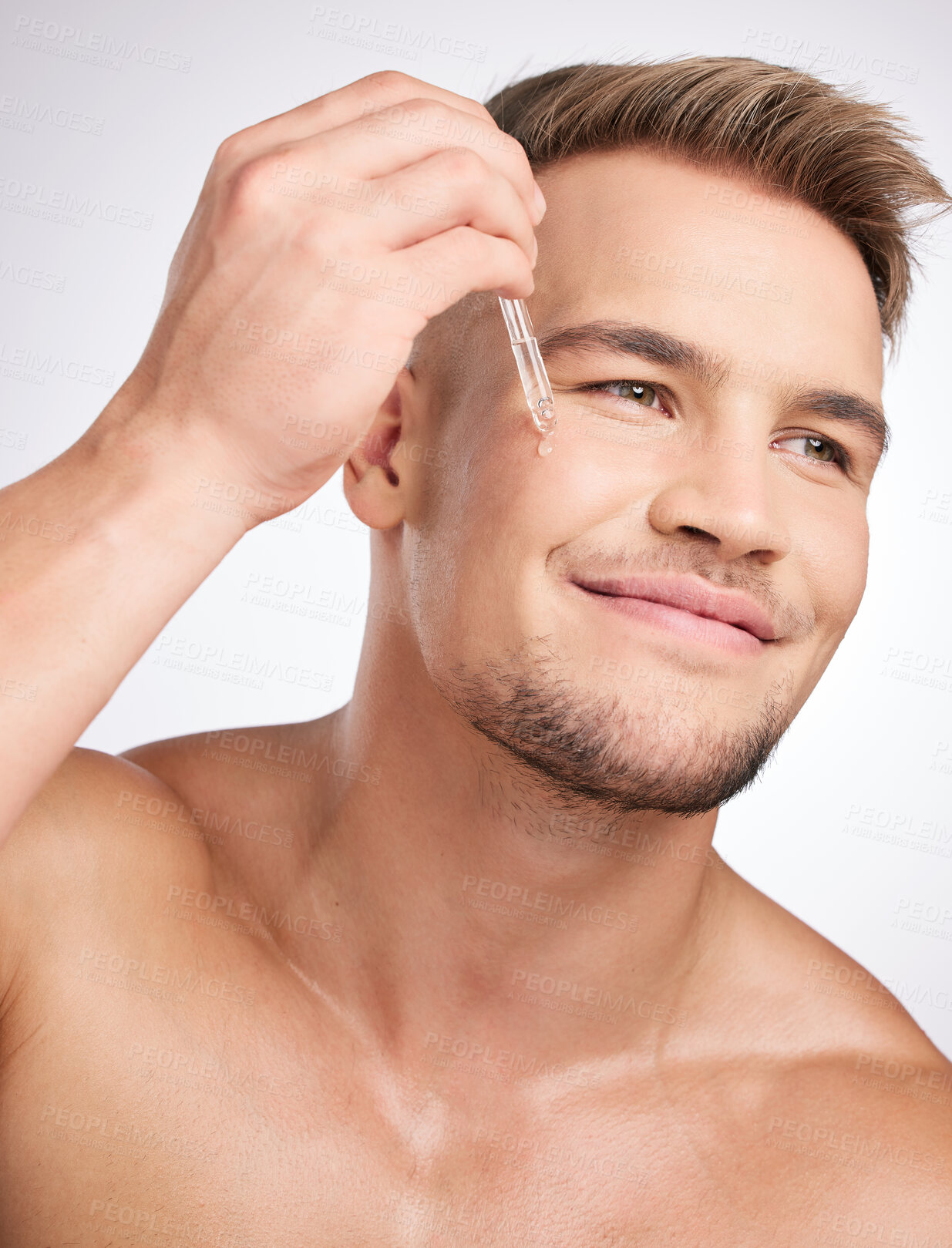 Buy stock photo Cosmetics, man and liquid serum on face for skincare, wellness and hygiene in studio white background. Male person, health product and dermatology grooming for collagen treatment or essential oil