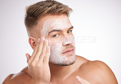 Buy stock photo Beauty, skincare or man with face wash in studio for facial treatment, grooming or dermatology on white background. Wellness, cosmetic and model for healthy pores, morning routine or mask product