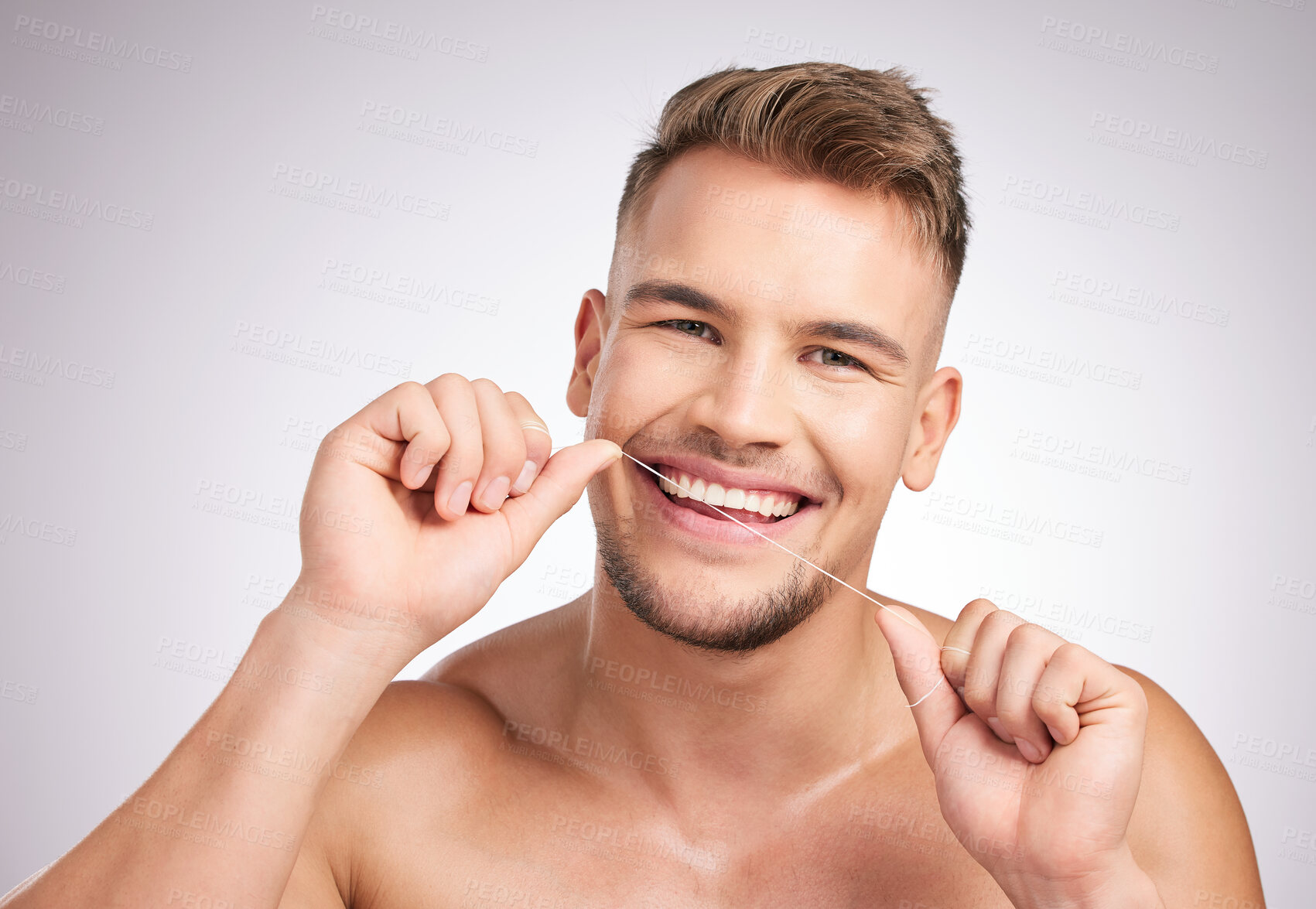 Buy stock photo Dental floss, portrait and man in studio for teeth cleaning, self care and morning routine on white background. Oral hygiene, confidence and model for wellness, fresh breath and healthy mouth.