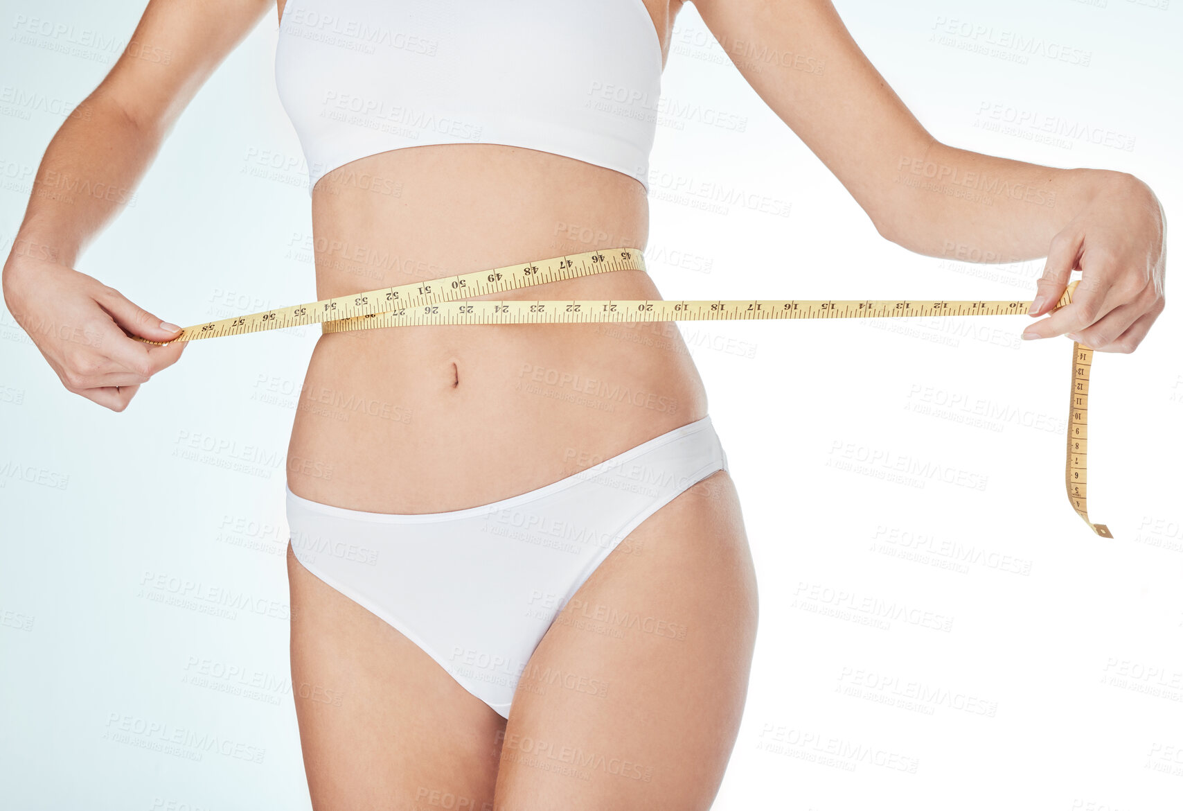 Buy stock photo Woman, underwear and tape measure for weight loss, fitness and healthy diet in white studio background. Female person, progress or stomach check for wellness, body and liposuction or tummy tuck