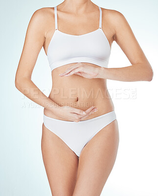 Buy stock photo Woman, underwear and hands on stomach for probiotics, digestion or gut health in white studio background. Female person, diet and touching tummy for wellness, nutrition and balance on mockup