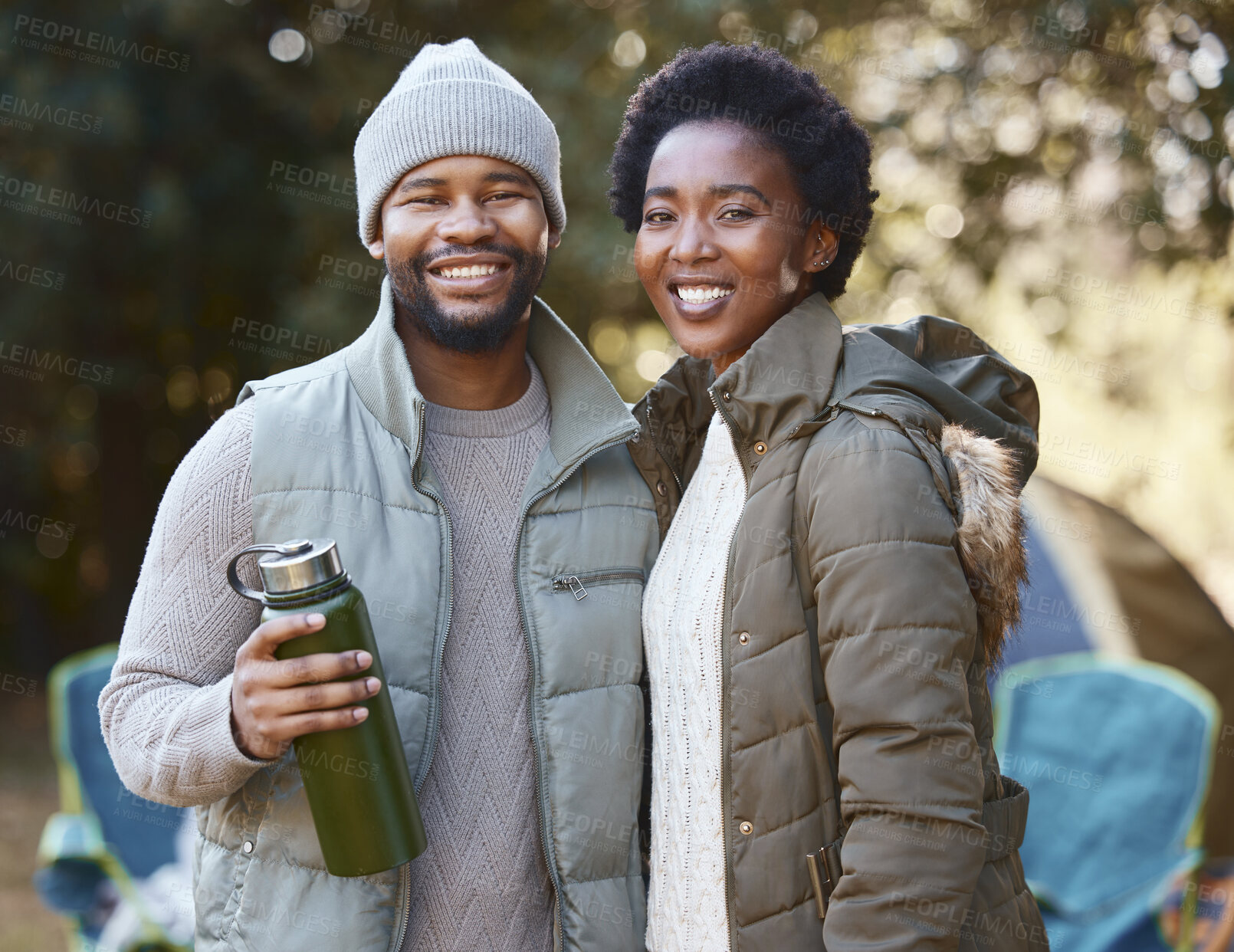 Buy stock photo Black couple, camping and nature with portrait, smile and adventure for vacation outdoors with water bottle. Tent, trekking and countryside for husband and wife person, hiking and drink in wilderness