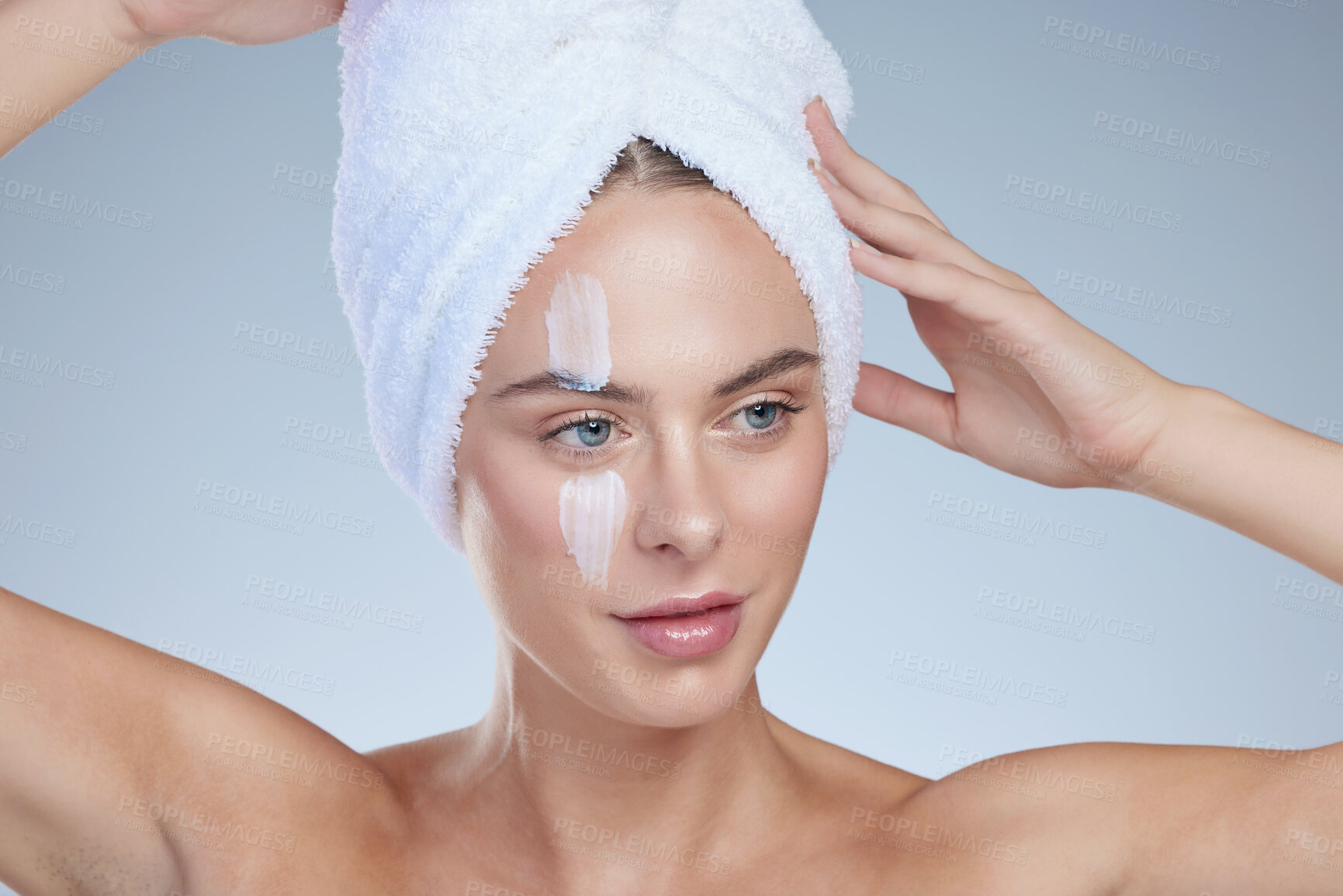 Buy stock photo Woman, skincare and thinking in studio with cream for hydration, wellness or cosmetics. Towel, model girl and idea for beauty and lotion for dermatology, collagen or anti ageing by white background