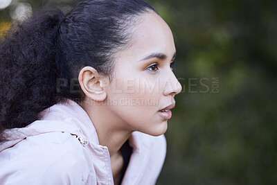 Buy stock photo Shot of a beautiful young woman out for a run