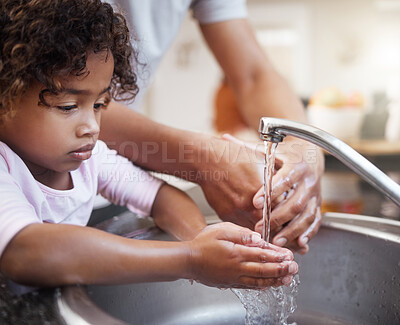 Buy stock photo Child, washing hands and learning hygiene with parent for healthcare, development and bacteria removal in home. Girl, adult and water for cleaning palm with healthy habit, support and germ safety