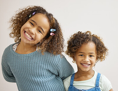 Buy stock photo Shot of two adorable little girls standing together and posing