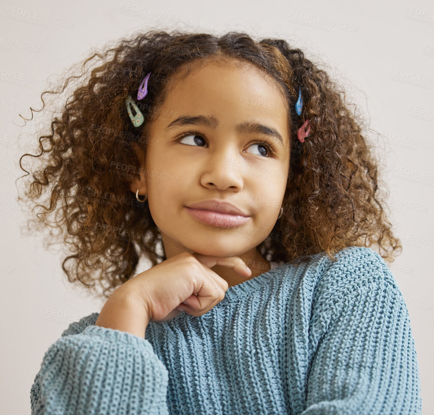 Buy stock photo Shot of an adorable little girl standing alone and looking contemplative