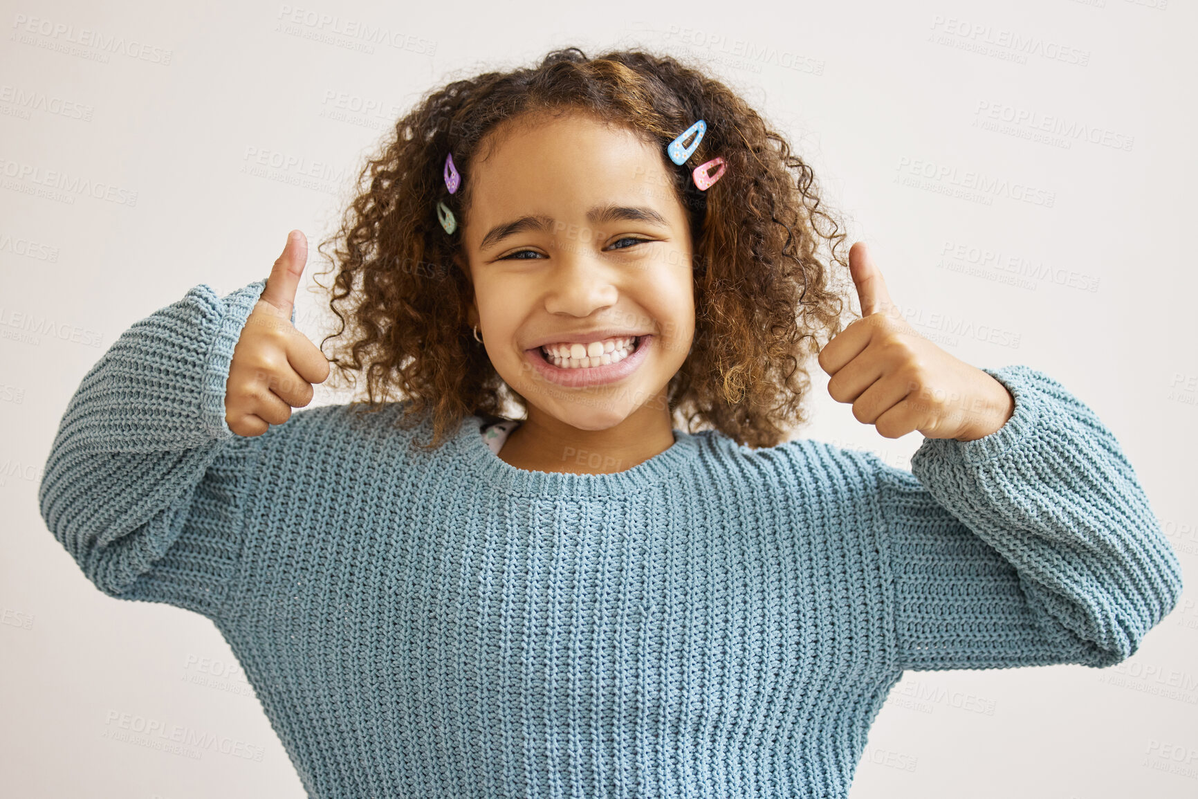 Buy stock photo Girl, smile and studio with portrait or thumbs up for support, happiness with like or approval. Female child, white background and satisfaction with hand gesture or vote, excited yes or agreement