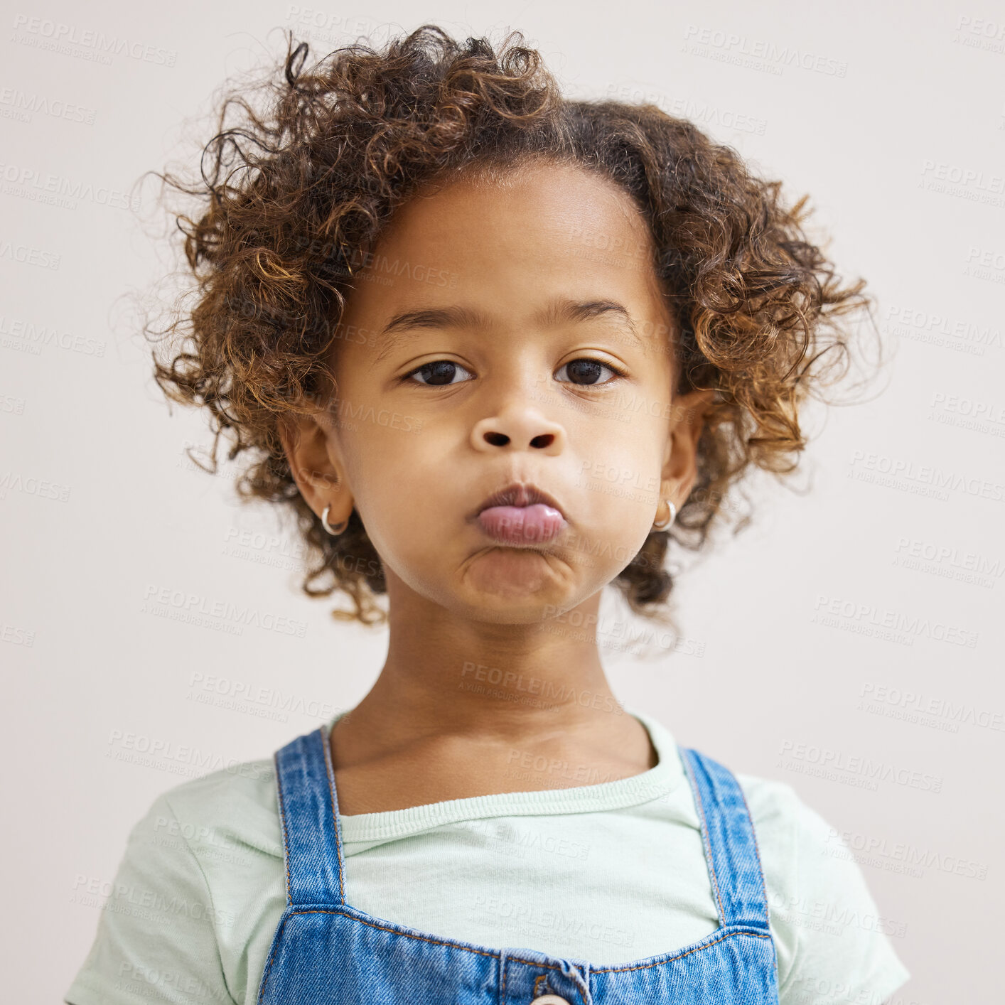 Buy stock photo Girl child, portrait and upset in studio for facial expression, mad tantrum or frustrated attitude. White background, pout or kid with disappointment or sad face for grumpy emoji, cross with adhd