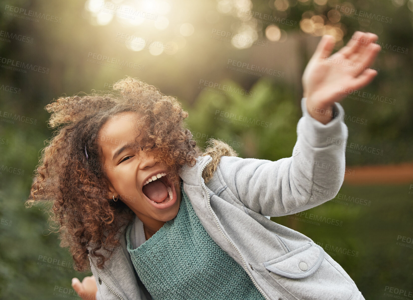 Buy stock photo Girl child, outdoor and excited energy in portrait for vacation with wellness, hands for play in New York City. Winter, laugh and female kid with happiness in Central Park, holiday or travel freedom