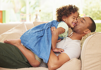 Buy stock photo Father, girl and hug or kiss in home, relax together and affection for child or love in living room. Daddy, daughter and embrace for security in relationship, family and bonding on couch for support