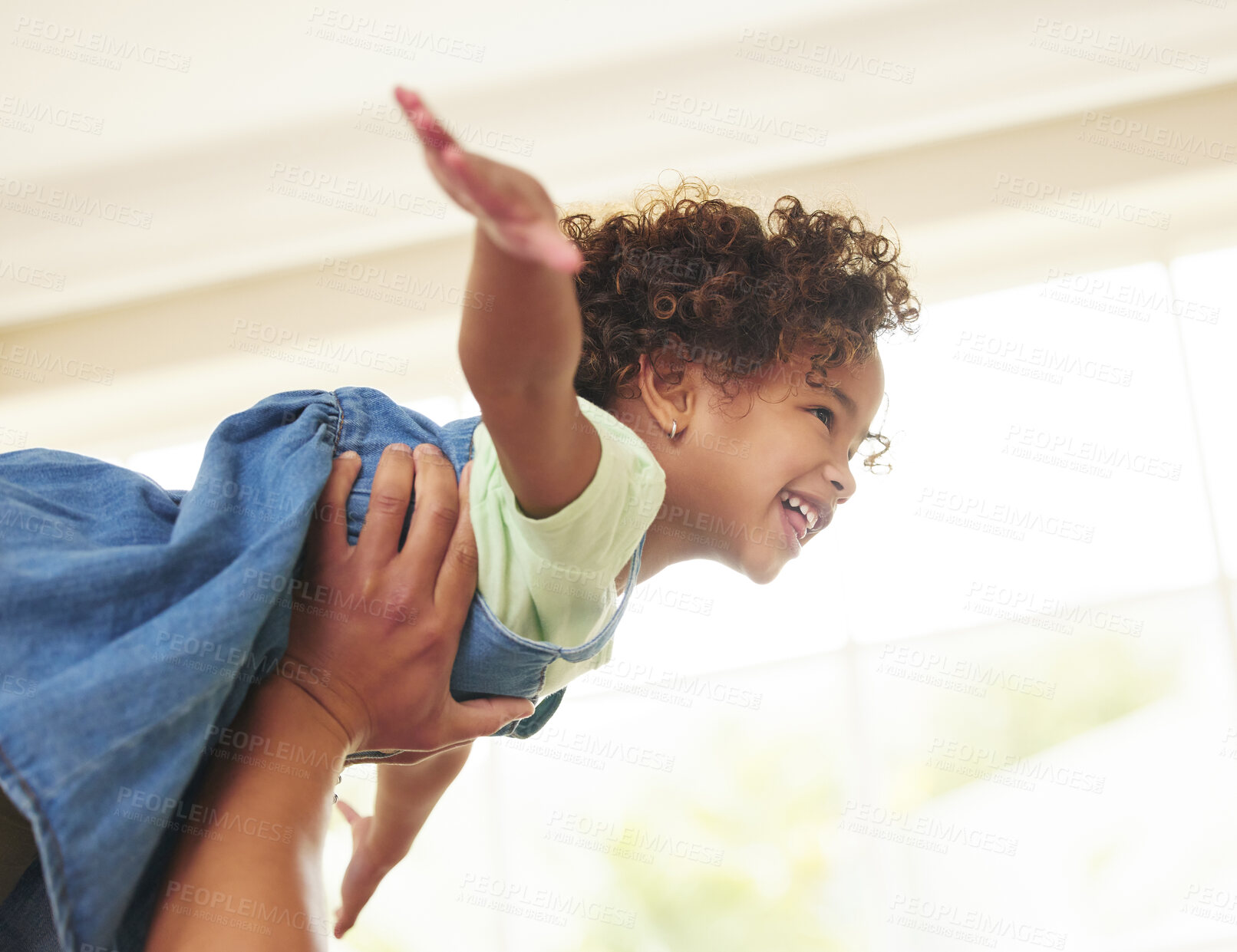 Buy stock photo Father, girl and hands for flying in home, bonding and game for fun or love in childhood. Family, daughter and playing with child together in living room, happiness and weekend for airplane lifting