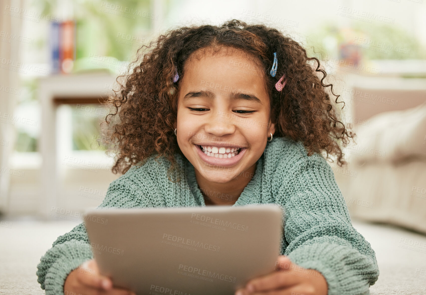 Buy stock photo Girl child, home and smile with tablet for education or learning, online game or streaming for school. Female kid, development and growth in house with website app for information, tech for knowledge