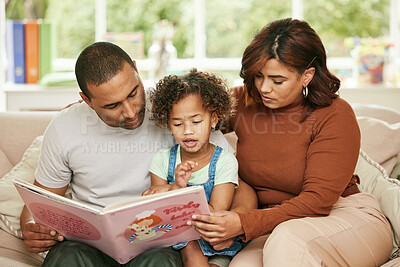 Buy stock photo Father, Mom and child with reading book on sofa for family bonding, learning and development in lounge. Parents, kids and together in home for storytelling, parent teaching or childhood growth