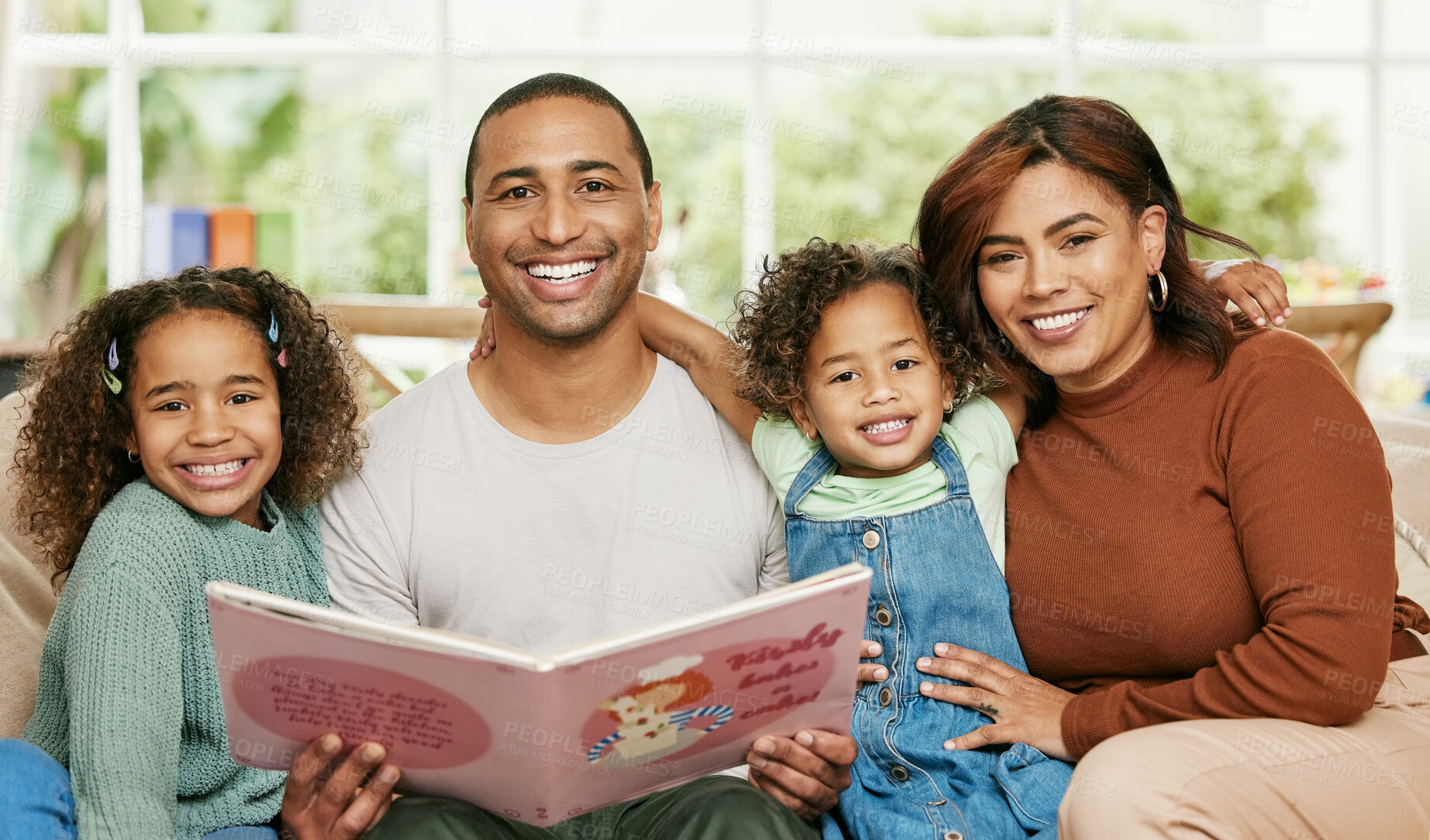 Buy stock photo Father, Mom and children with reading book in house for family bonding, learning and development in lounge. Parents, kids and together on sofa for storytelling, teaching language for growth skills