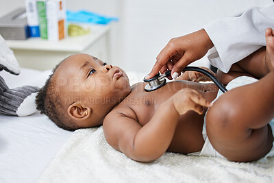 Buy stock photo Shot of a doctor listening to a baby's chest using a stethoscope