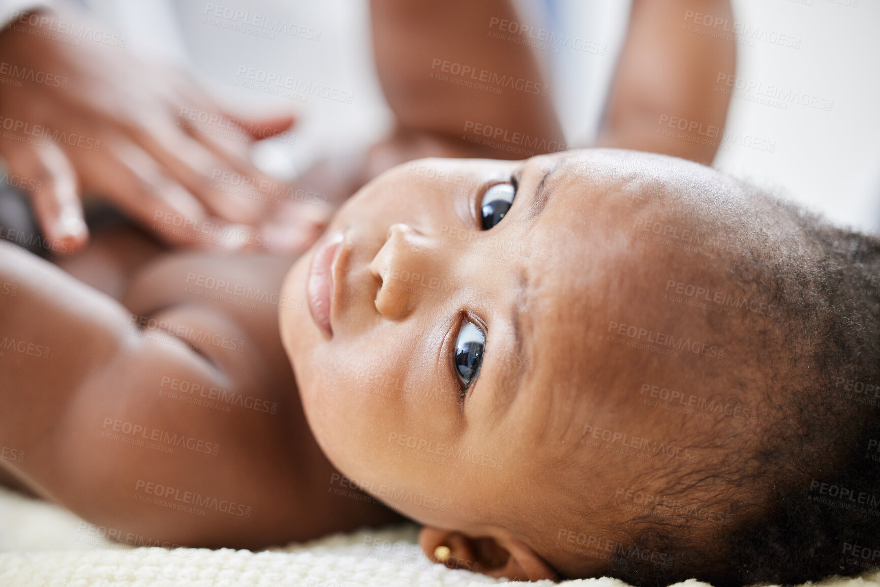 Buy stock photo Shot of a little baby getting a checkup by a doctor