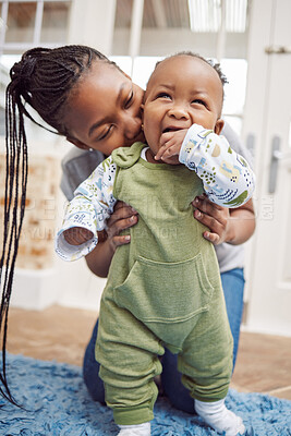 Buy stock photo Shot of a young woman bonding with her baby at home